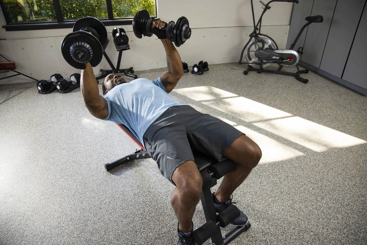 Weight bench dumbbell exercises for a home workout