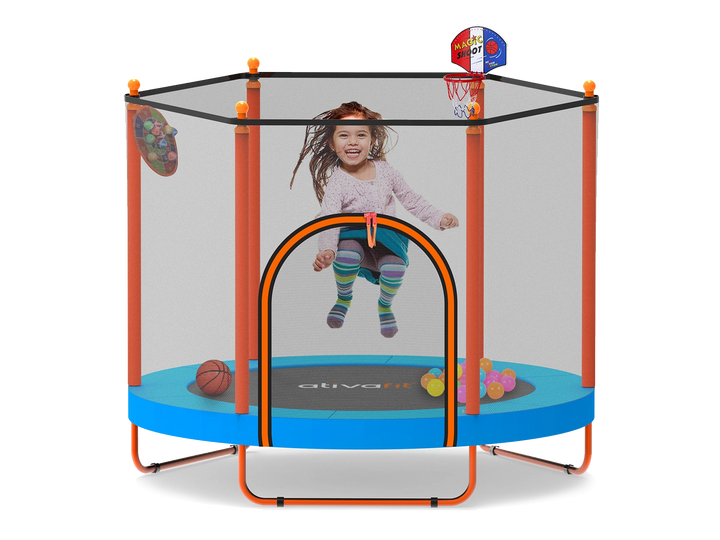 Child playing inside a  trampoline with basketball hoop and sports ball toys on a white background